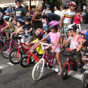 Children learning to bicycle.